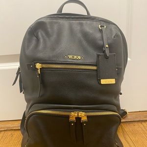 TUMI leather voyageur backpack with gold hardware